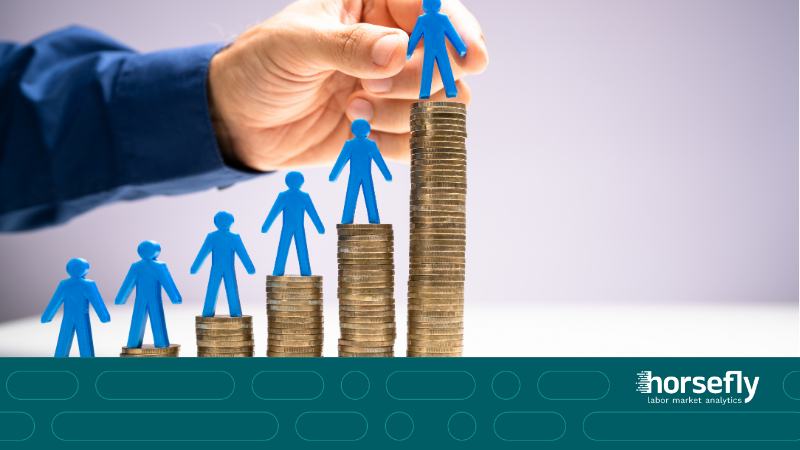 Image shows piles of coins in ascending order with figures of people on the top of each pile for the blog - Driving Pay Equity Through Advanced Compensation Benchmarking Analytics